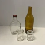 Lot Of Four Glass Bottles 6 AMBER,2 Clear Crock 1 Syrup Dollhouse. Fixed Price $10.00.